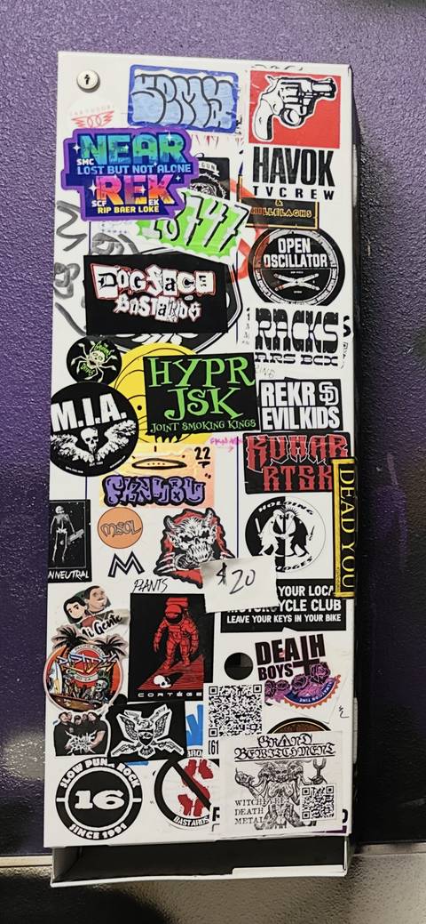 Sticker-bombed dispenser
