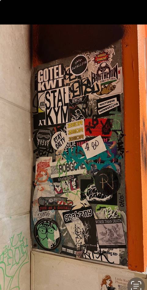 Sticker-bombed metal panel